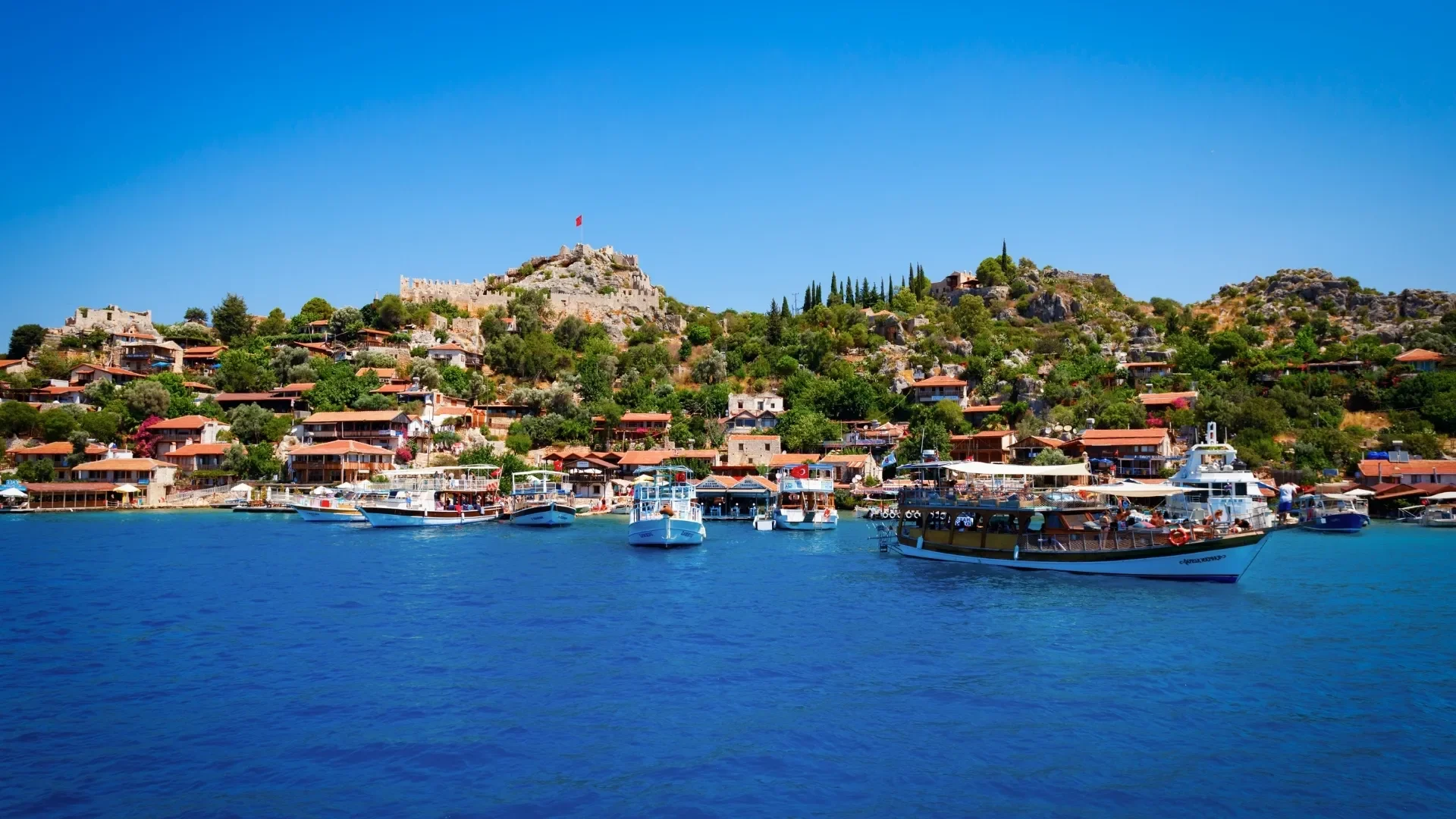 Discover the charming coastal village of Kaleköy, where ancient ruins meet the blue waters of the Mediterranean.