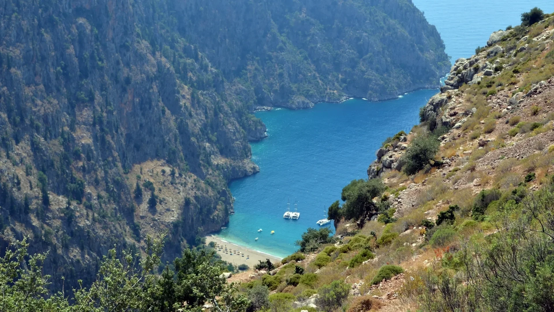 Wake up to breathtaking views of Butterfly Valley, one of the most spectacular natural stops along the Turkish Riviera.