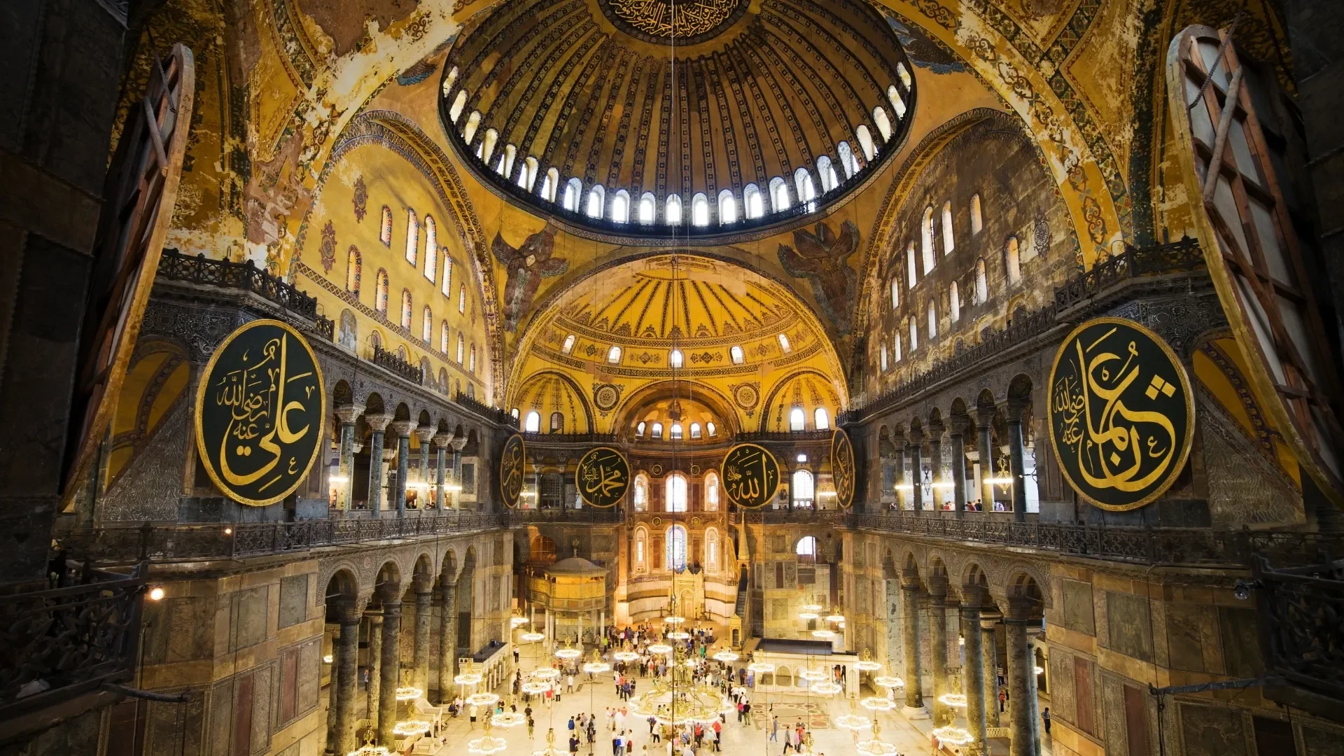 Inside Hagia Sophia, visitors experience grand architecture, historic galleries and centuries of cultural heritage in Istanbul.