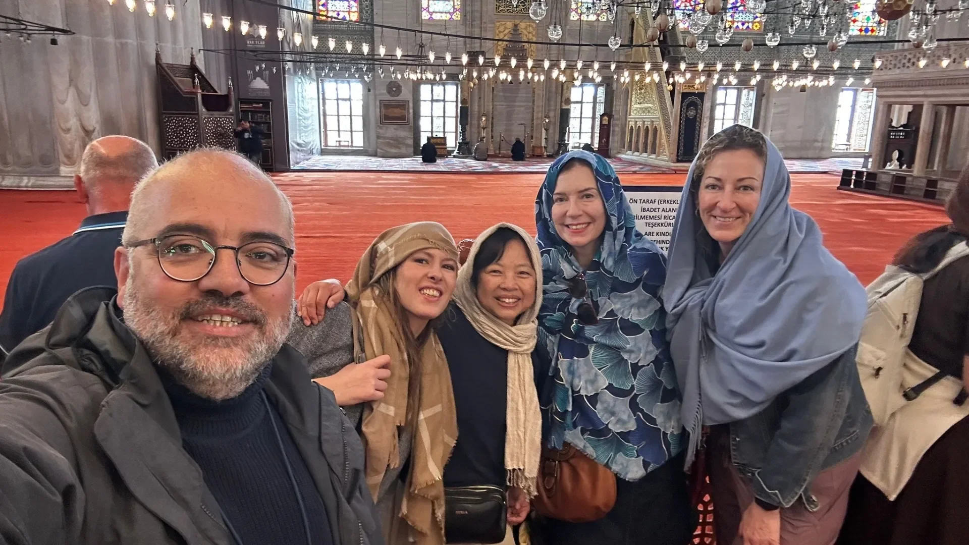 A friendly guided moment inside Blue Mosque, one of the must-see landmarks included in the Best of Istanbul tour route.