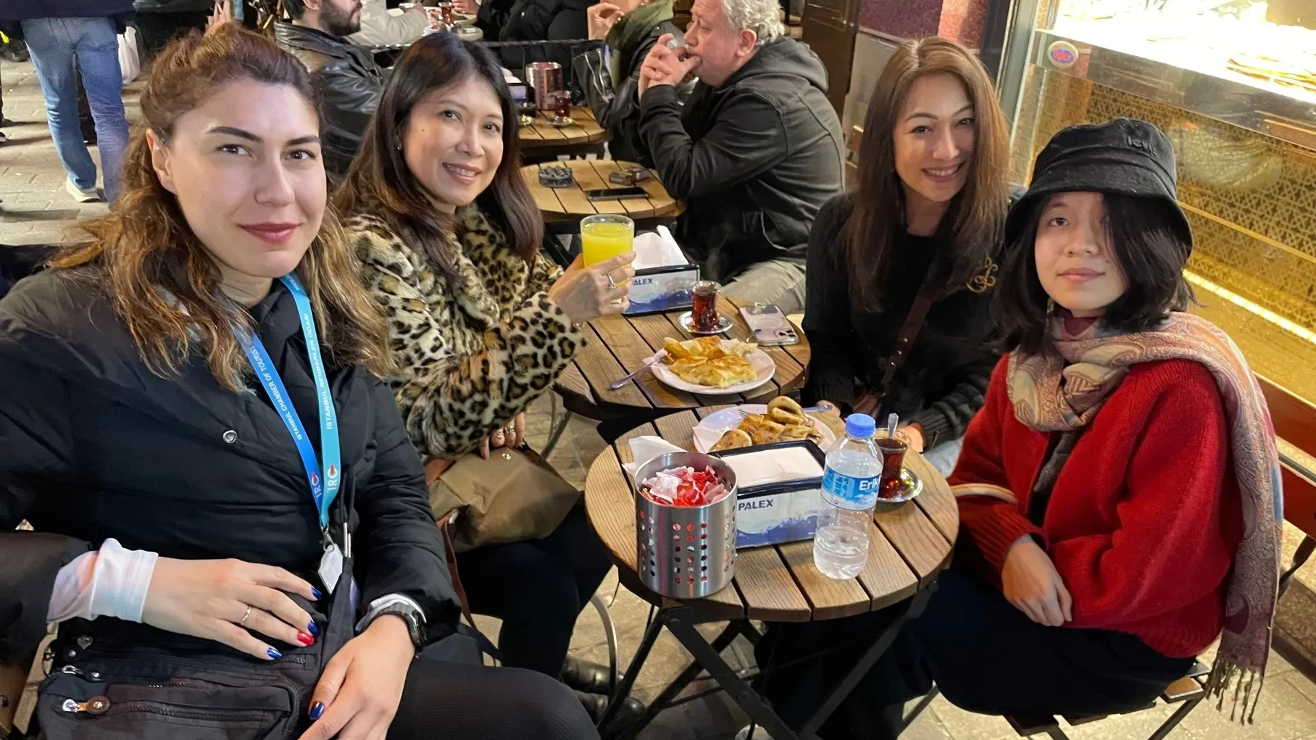 Istanbul Night Food Tour with Traditional Meyhane Experience: Group of Friends Tasting Istanbul Food with Their Professional Guide