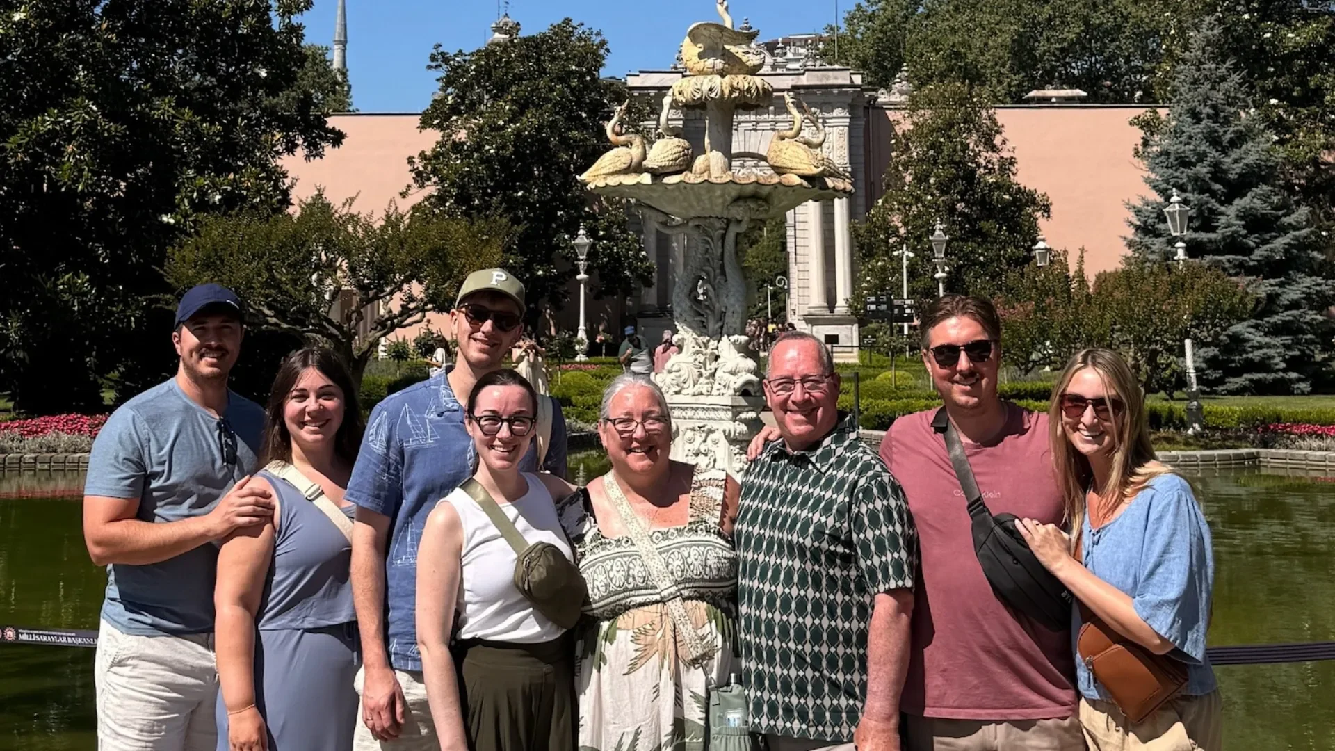 Travelers exploring Dolmabahce Palace gardens on a small group Istanbul cultural and historical tour.