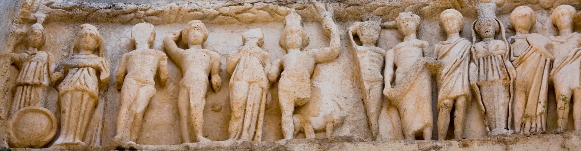 Ancient Roman relief sculptures carved into stone during a historical Turkey tour