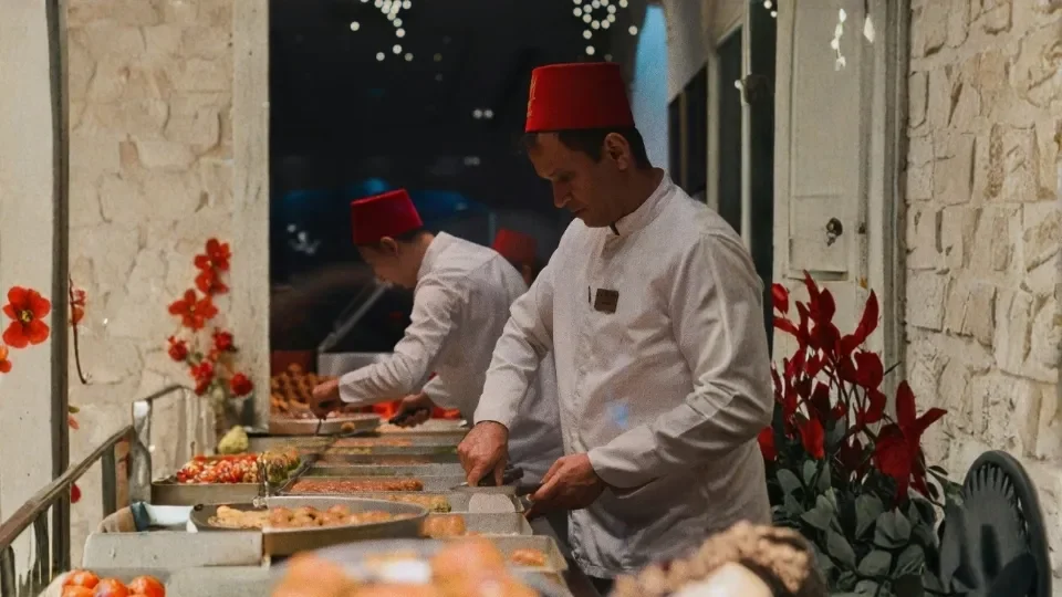 Turkish Man with Fex Serving Baklava